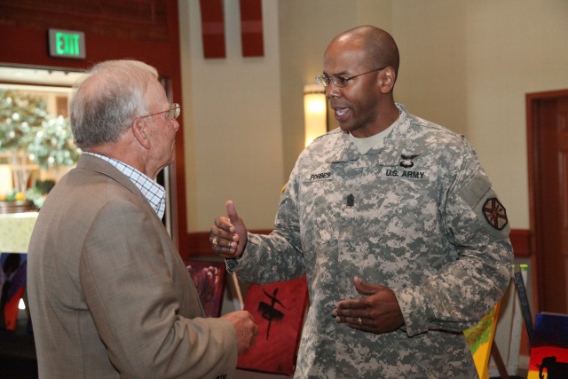 Command Sgt. Maj. Forbes talks to retired SMA Jack Tilley