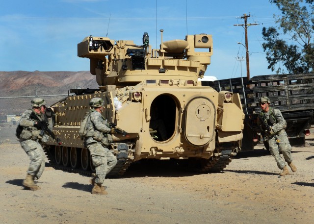 Soldiers of 1st Armored Brigade Combat Team, 1st Cavalry Division take cover