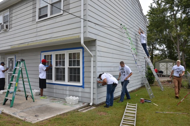 688th RPOE Soldiers painting homes for the needy