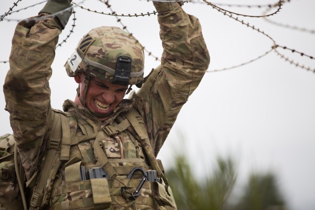 3rd Infantry Division Soldier hold concertina wire