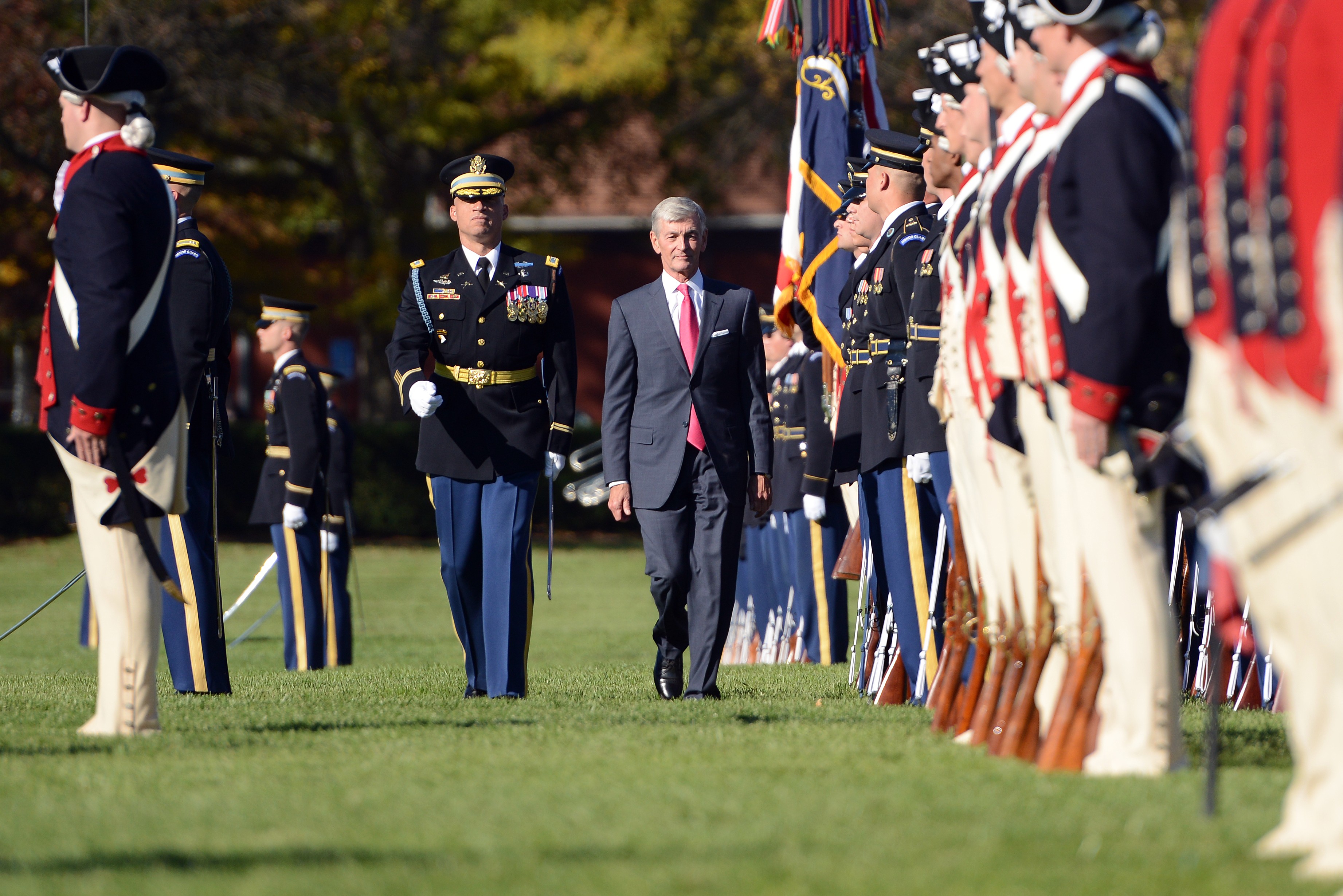 Secretary of Defense Ash Carter steadies his hand using the