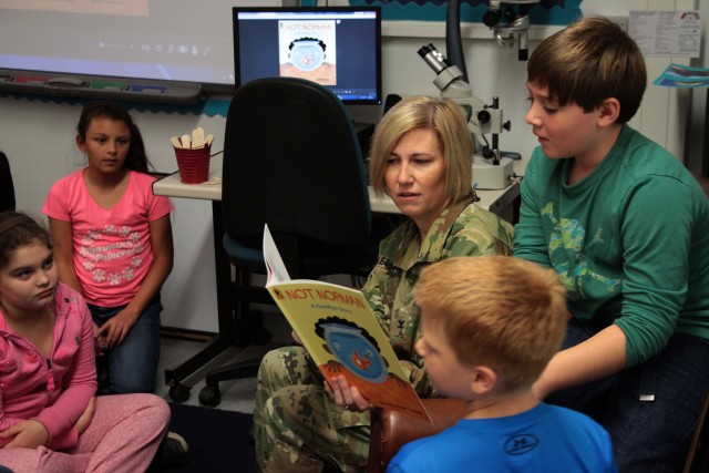 Col. Michelle Letcher reads to Smith Elementary class