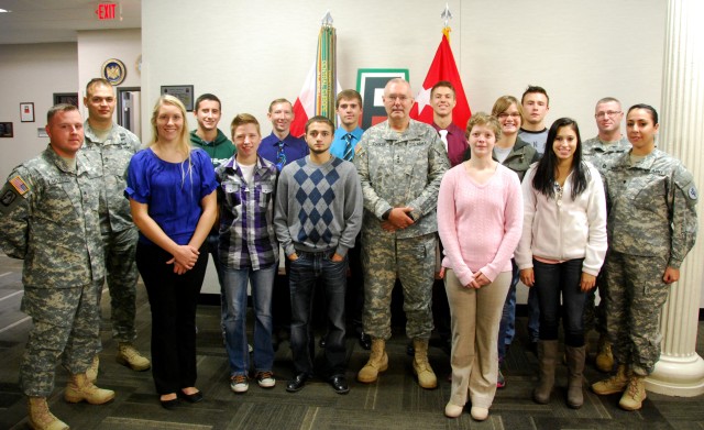 Lt. Gen. Michael S. Tucker and students stand together for a photo at First Army Headquarters at Rock Island Arsenal on October 20.