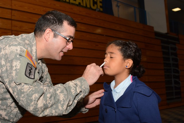 Joanne Landrum gets inoculated against the flu at Fort Jackson