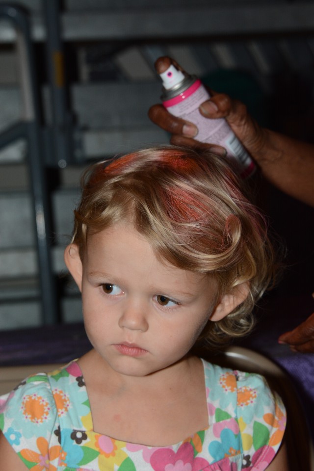 Krista Brandon gets new hair color at the Fort Jackson Fall Festival
