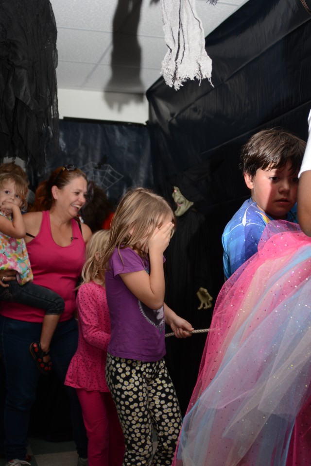 The Brandons make their way through the Haunted Room at Fort Jackson