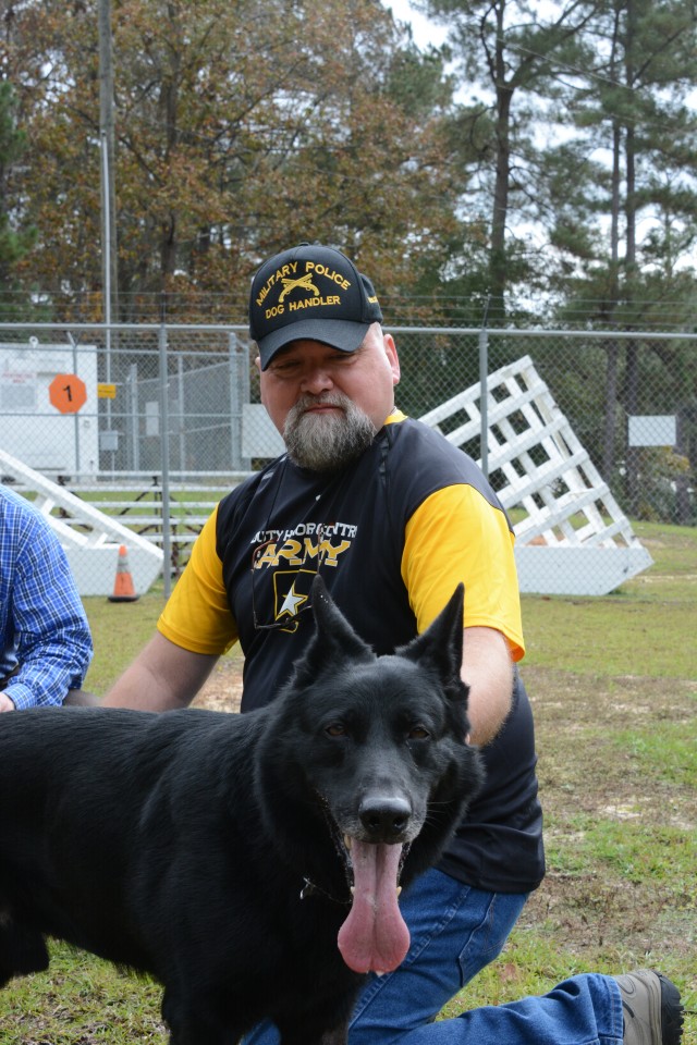 Veteran dog handler takes time out with a military working dog at Fort Jackson