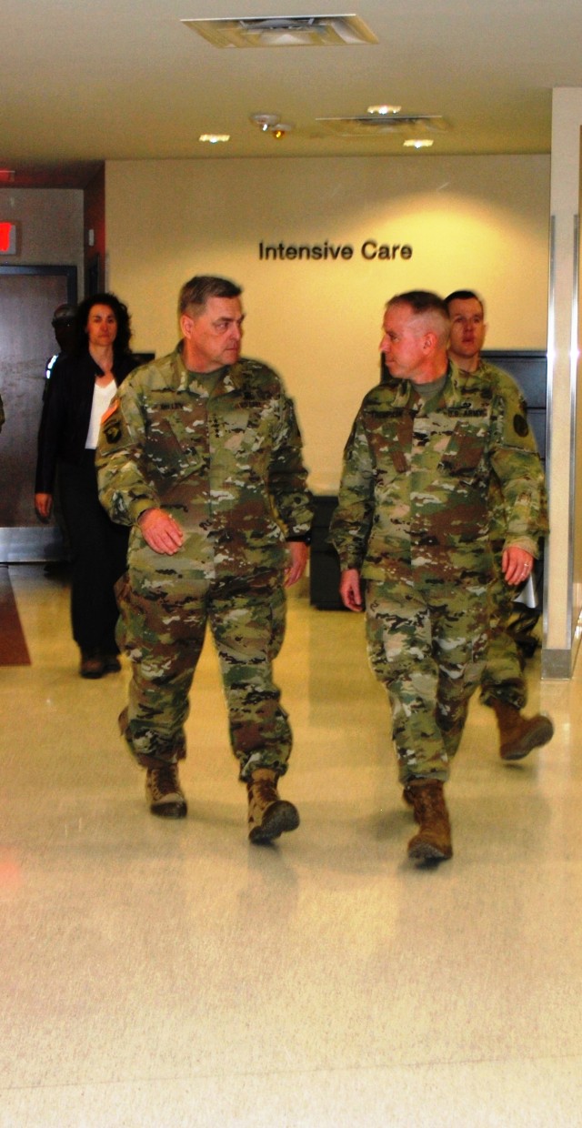 Gen. Mark Milley, U.S. Army Chief of Staff discusses the new hospital opening with Col. Mark Thompson on a walking tour Nov. 24.