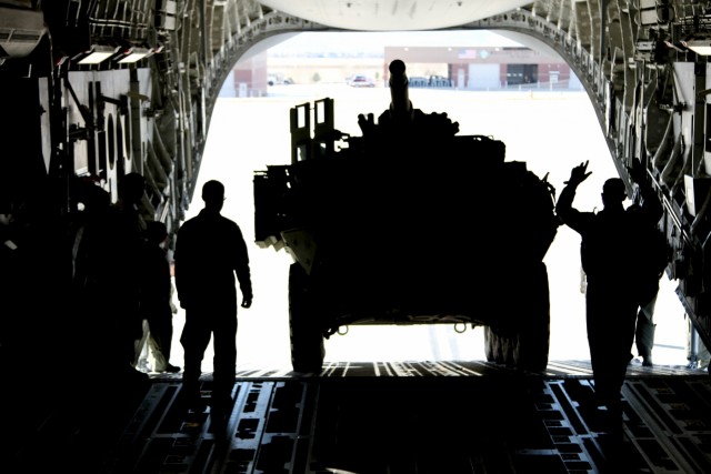Soldiers, Airmen partner for Mobile Gun System Stryker air mobility
