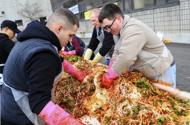 Mixing kimchi