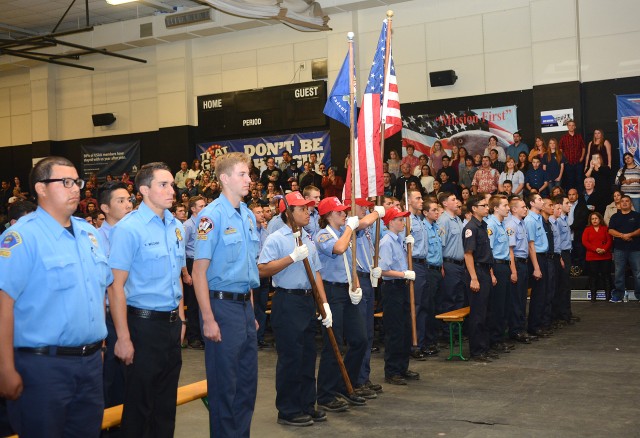 Fire explorers color guard prepares to post the nation's flag