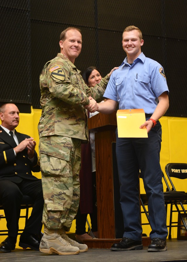 Fort Irwin United States Army Garrison Commander Col. Scott Taylor and Fire Explorer Jacob Sobrito