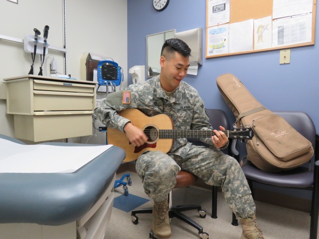 Doctor comforts patients through music