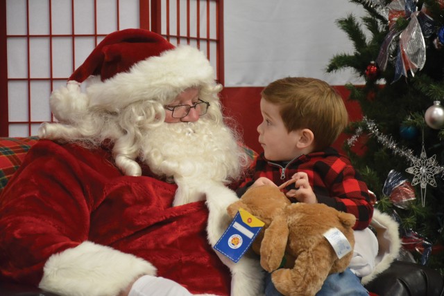 Easton Lipsey, 3, son of Staff Sgt. Jake Lipsey, 1st Combined Arms Battalion, 63rd Armor Regiment, 2nd Armored Brigade Combat Team, 1st Infantry Division, at Fort Riley Kansas, visits Santa Claus Dec.