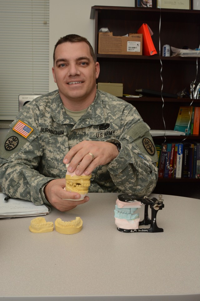 Dr. Burningham shows off dental molds