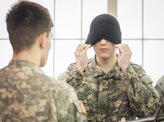 Female cadet gets blindfolded for Combat Water Survival Test