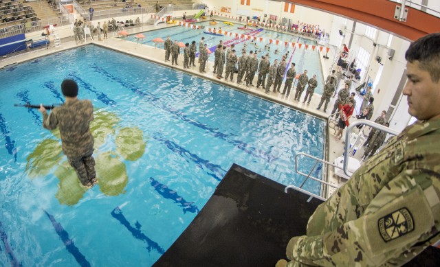 U.S. Army ROTC cadet launches into pool