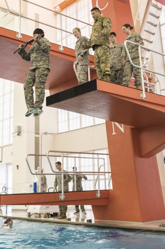 Female cadet takes 5 meter drop blindfolded with M16