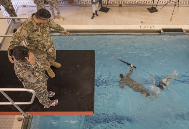 Female cadet mentally prepares for 5-meter drop