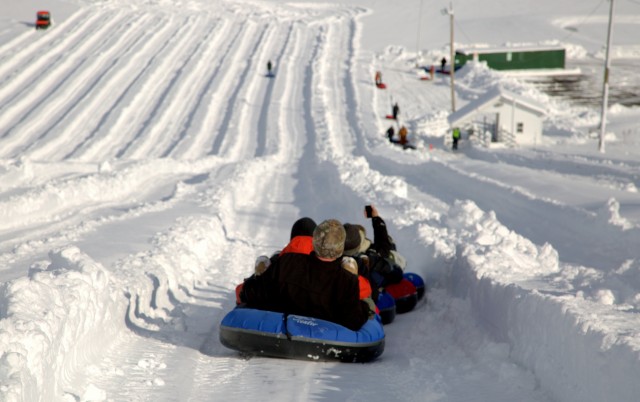 WTB members slides down the tubing track 