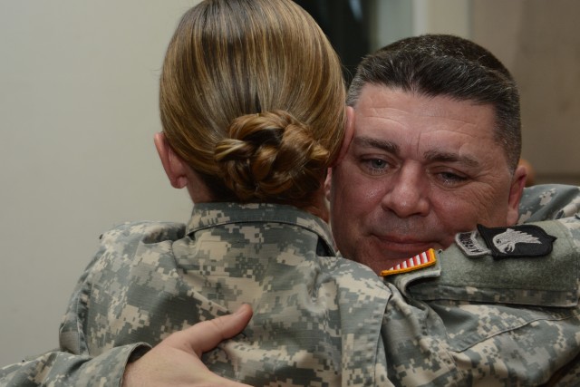 Staff Sgt. Brian Mackey receives congratulatory hug