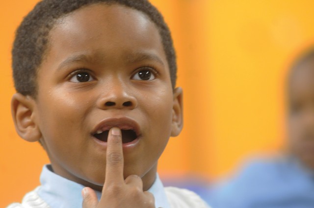 Boys and girls club patron thinks of an answer