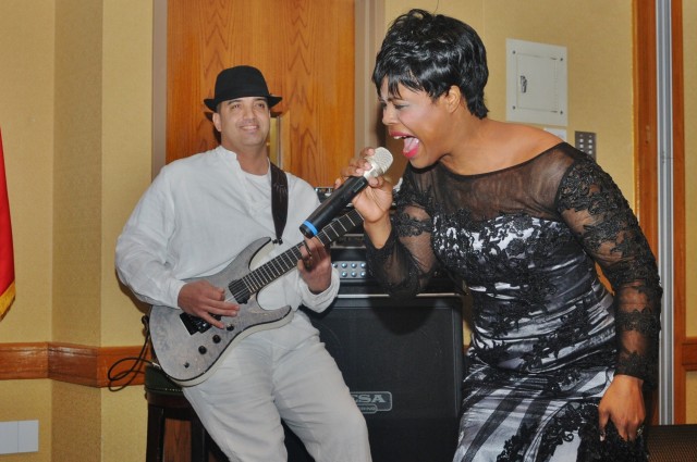 Staff. Sgt. Catina Gardner, Headquarters and Headquarters Company, 65th Medical Brigade, performs at AABHM Observance