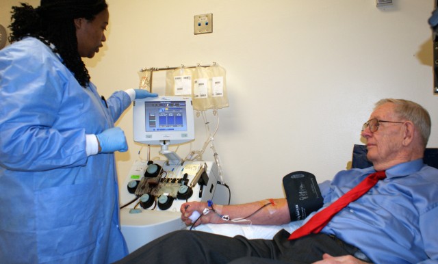 Al Whitney settles in while Robertson Blood Center phlebotomist, Jessica Johnson, monitors the platelet collection process. Whitney, who is from Cleveland, Ohio, recently brought his Platelets Across