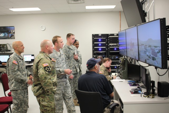 Army officers monitor and evaluate the action