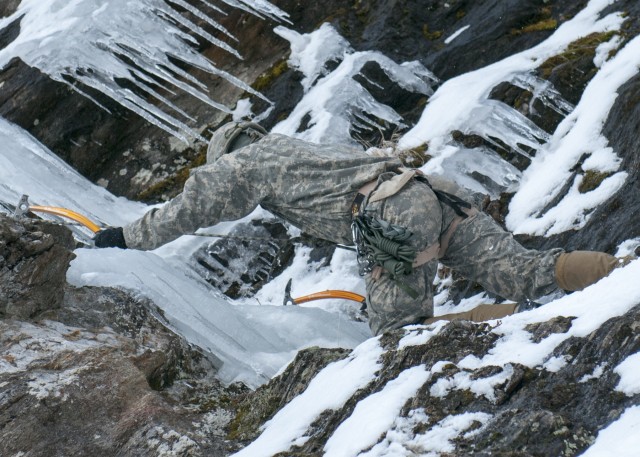 Vermont National Guard Soldier climbs an ice wall