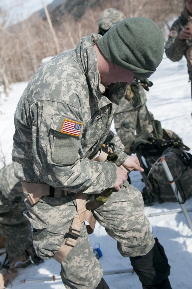 Vermont National Guard Soldier dons gears