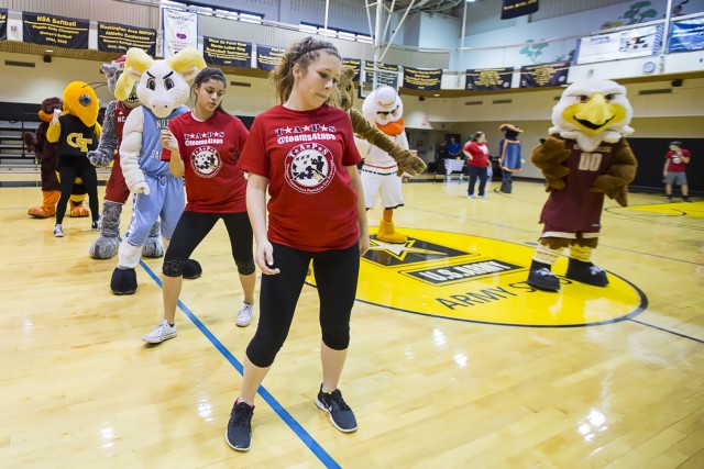 Atlantic Coast Conference mascots help greet children of fallen combat troops