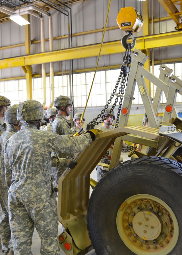 Engineers dismantle Husky for transport