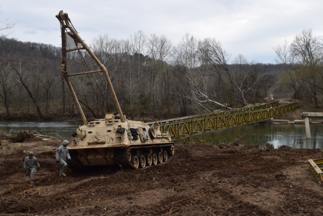 Engineers dismantle bridge toppled by flood