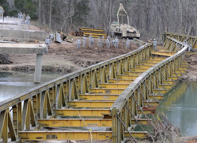 Engineers dismantle bridge toppled by flood