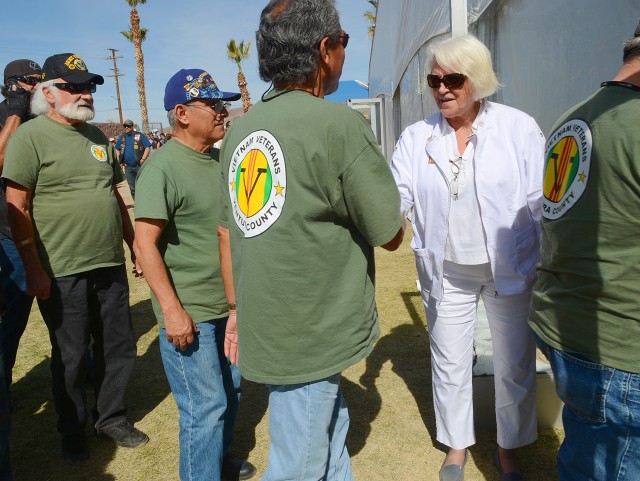 Elaine Krepp, of the Saddleback Valley Chapter of American Gold Star Mothers, greets Vietnam War era Veterans