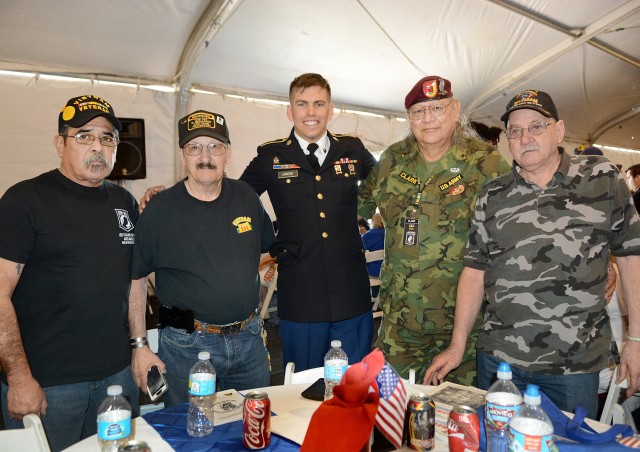 Spc. Cody Lamont (center) shared in camaraderie with Vietnam Veterans