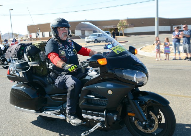 Vietnam War era Veteran rides his motorcycle in a parade at Fort Irwin