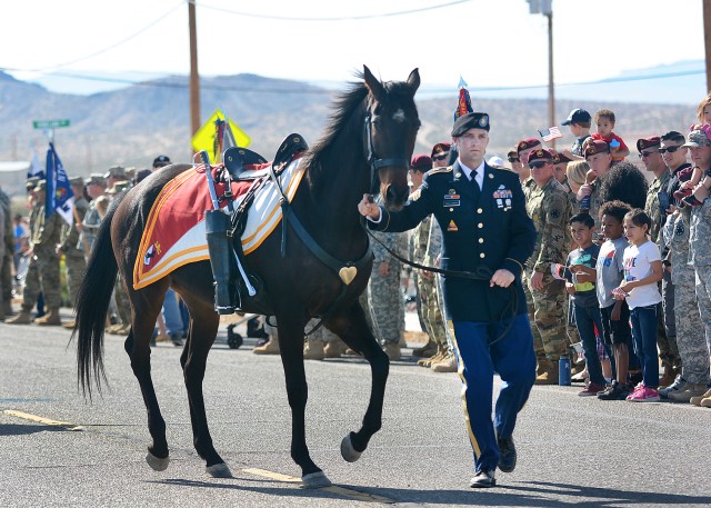 A riderless horse honors fallen Soldiers during a parade honoring Vietnam War era Veterans at Fort Irwin