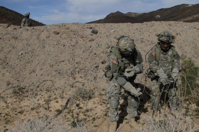 Brave Rifles Soldiers set up concertina wire