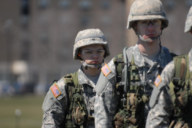 Cadet Caleb Goldfus, a freshman at Niagara University, back, prepares to board a UH-60M Black Hawk helicopter