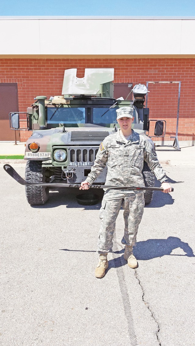 Police officer with the 116th Military Police Company, 97th Military Police Battalion, pursues her passion for ice hockey when not on duty with her unit
