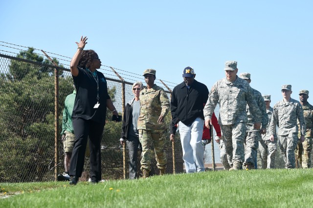 Soldiers and civilian staffs walk to spread sexual assault awareness