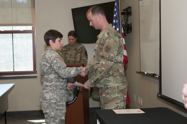 Soldier Given Certificate at Battle Hand-Off Ceremony