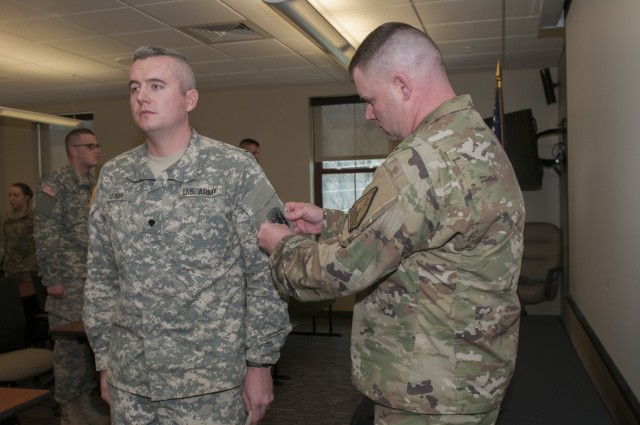 Soldier is Given Unit Patch