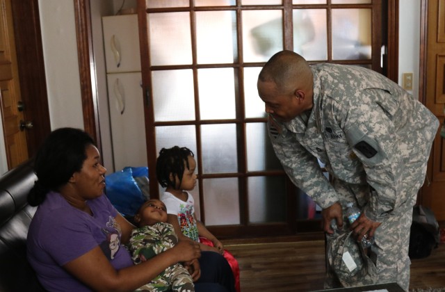 Soldier visits with family rescued from fire