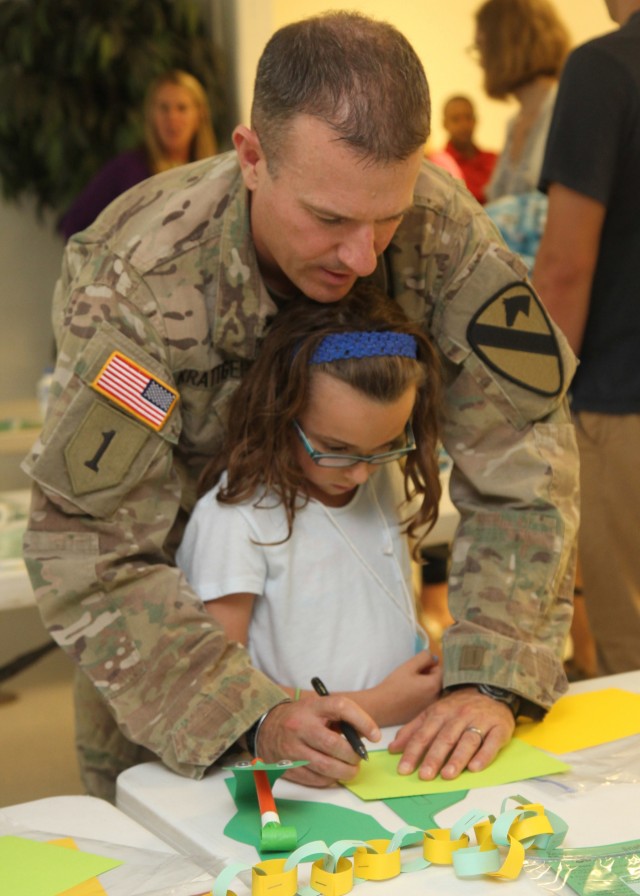 First Team commander reads for children