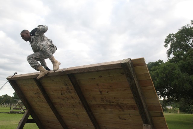 Sgt. Garrison clears wall in one leap