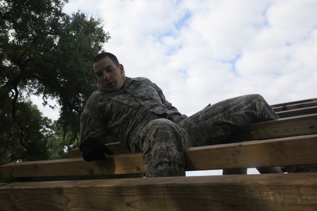 Spc. Nelson climbs the weaver