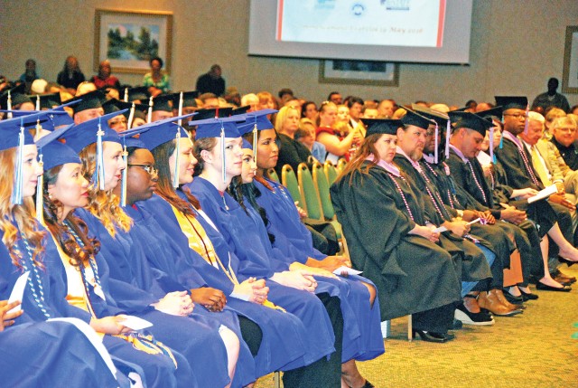 graduates of the Fort Riley community crossed the stage during the combined graduation ceremony at the Courtyard by Marriott and Geary County Convention Center in Junction City, Kansas, May 19